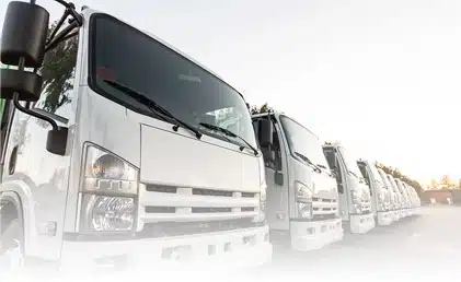 Line of Trucks with Fleet Management Solutions & Tracking Software