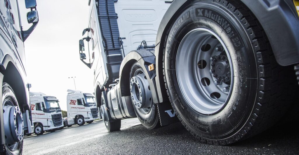 A fleet of trucks from the angle of the tyres with good tyre pressure